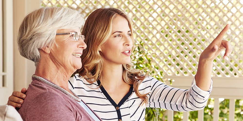 Elderly woman and younger woman talking outside Elderly woman and younger woman talking outside